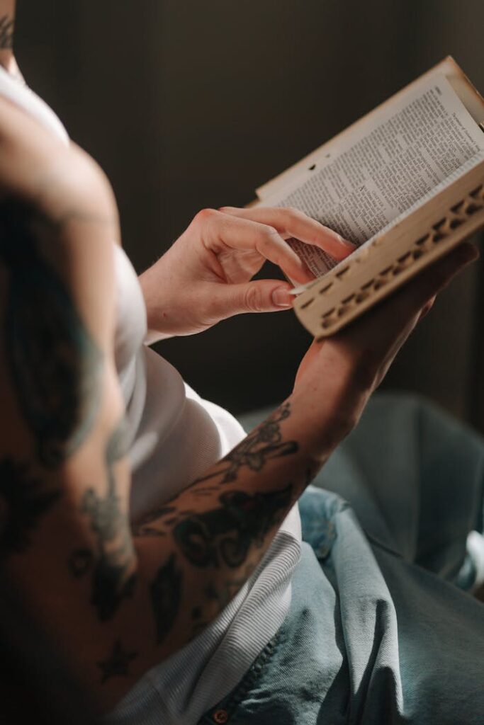 Close-Up Shot of a Person Reading a Bible